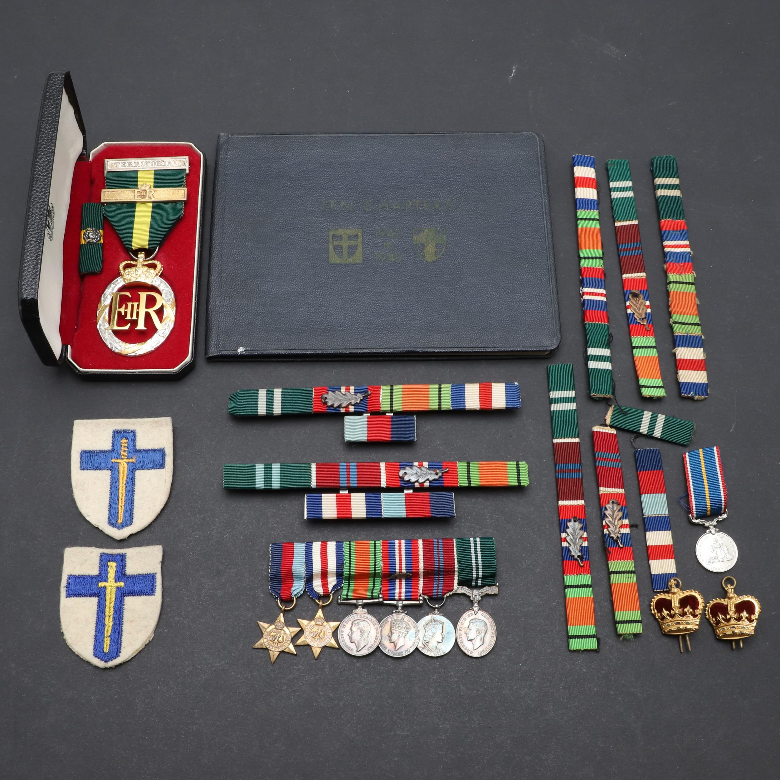 A TERRITORIAL EFFICIENCY MEDAL, A SET OF MINIATURES AND RIBBON BARS.