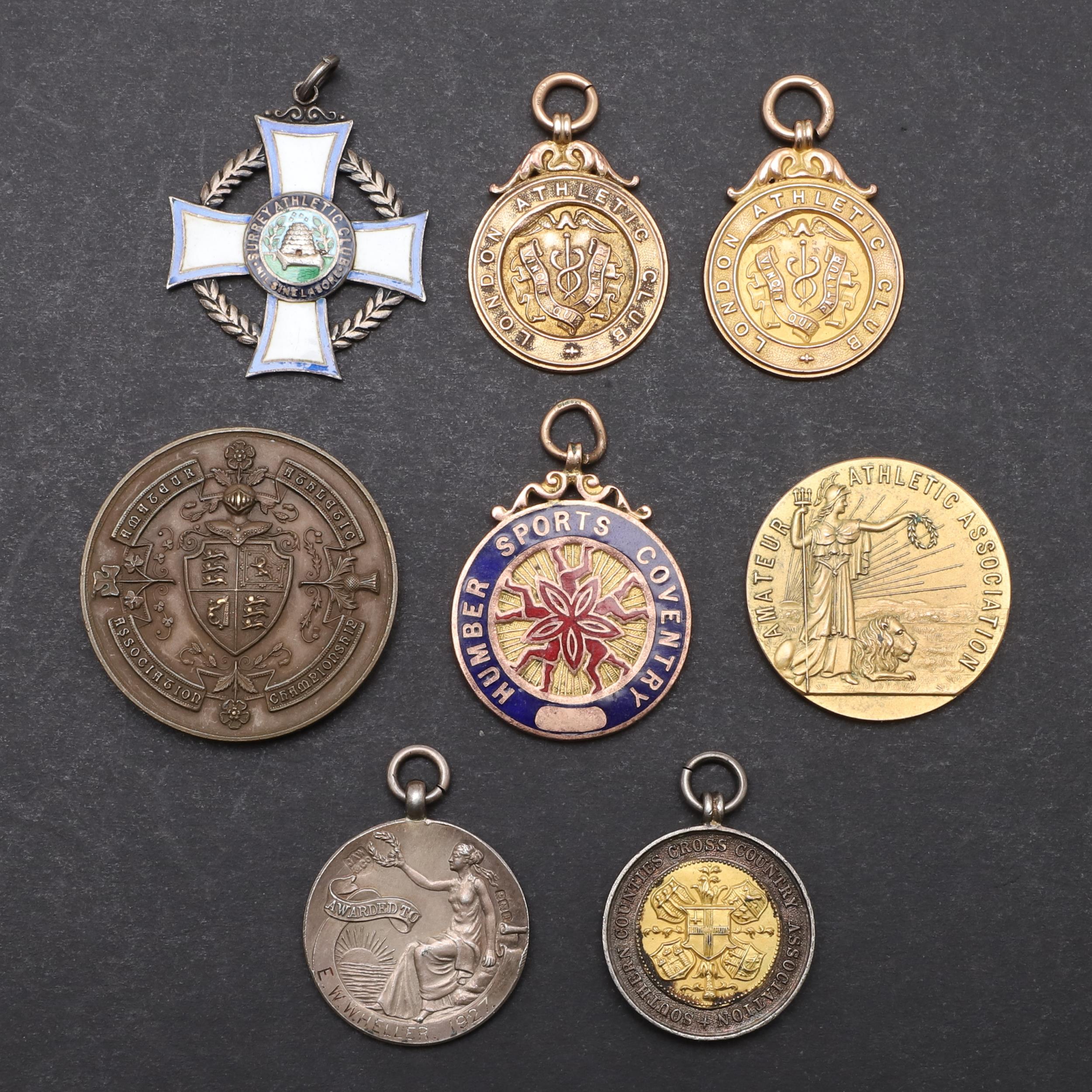 A COLLECTION OF GOLD AND SILVER SPORTING MEDALS TO INCLUDE A 1920'S OLYMPIC TRIALS MEDAL.