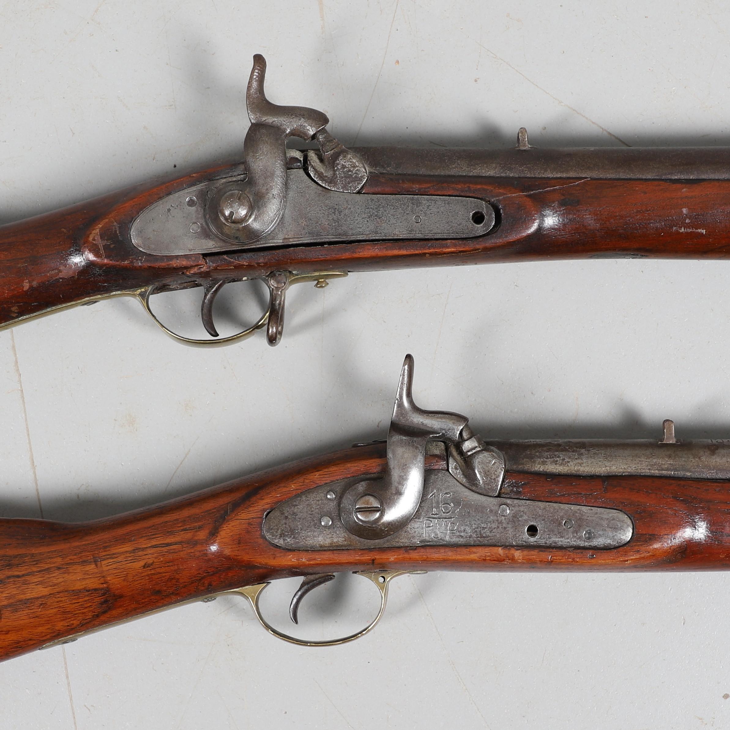 A 19TH CENTURY ENFIELD TYPE PERCUSSION FIRING RIFLE AND ANOTHER SIMILAR.