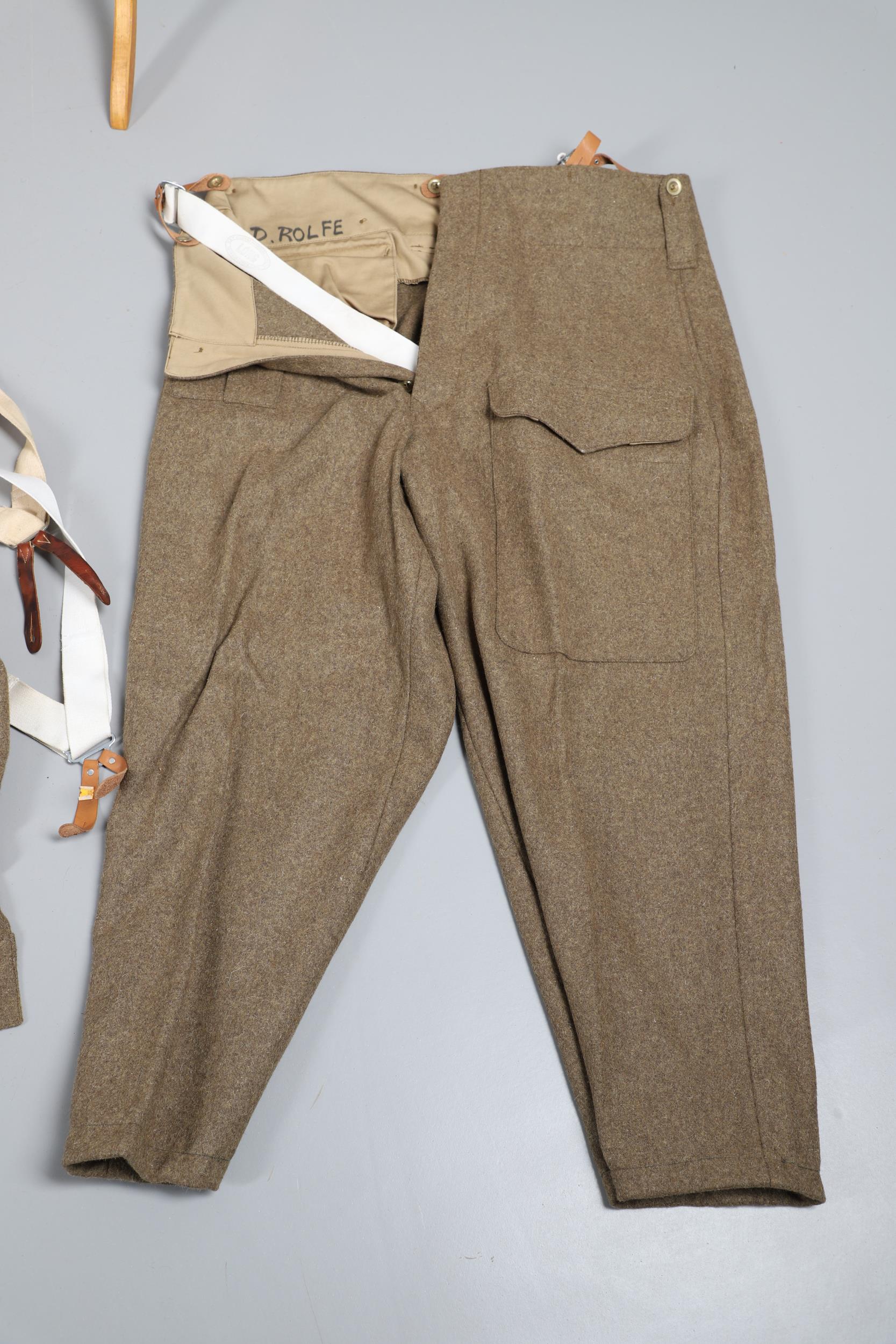A COLLECTION OF SECOND WORLD STYLE BATTLE TUNICS AND TROUSERS. - Image 21 of 24