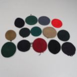 A COLLECTION OF MILITARY UNIFORM BERETS.