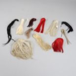 A COLLECTION OF HORSE HAIR HELMET PLUMES.