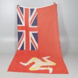 A LARGE ISLE OF MAN RED ENSIGN WITH TRISKELION TO THE GROUND.