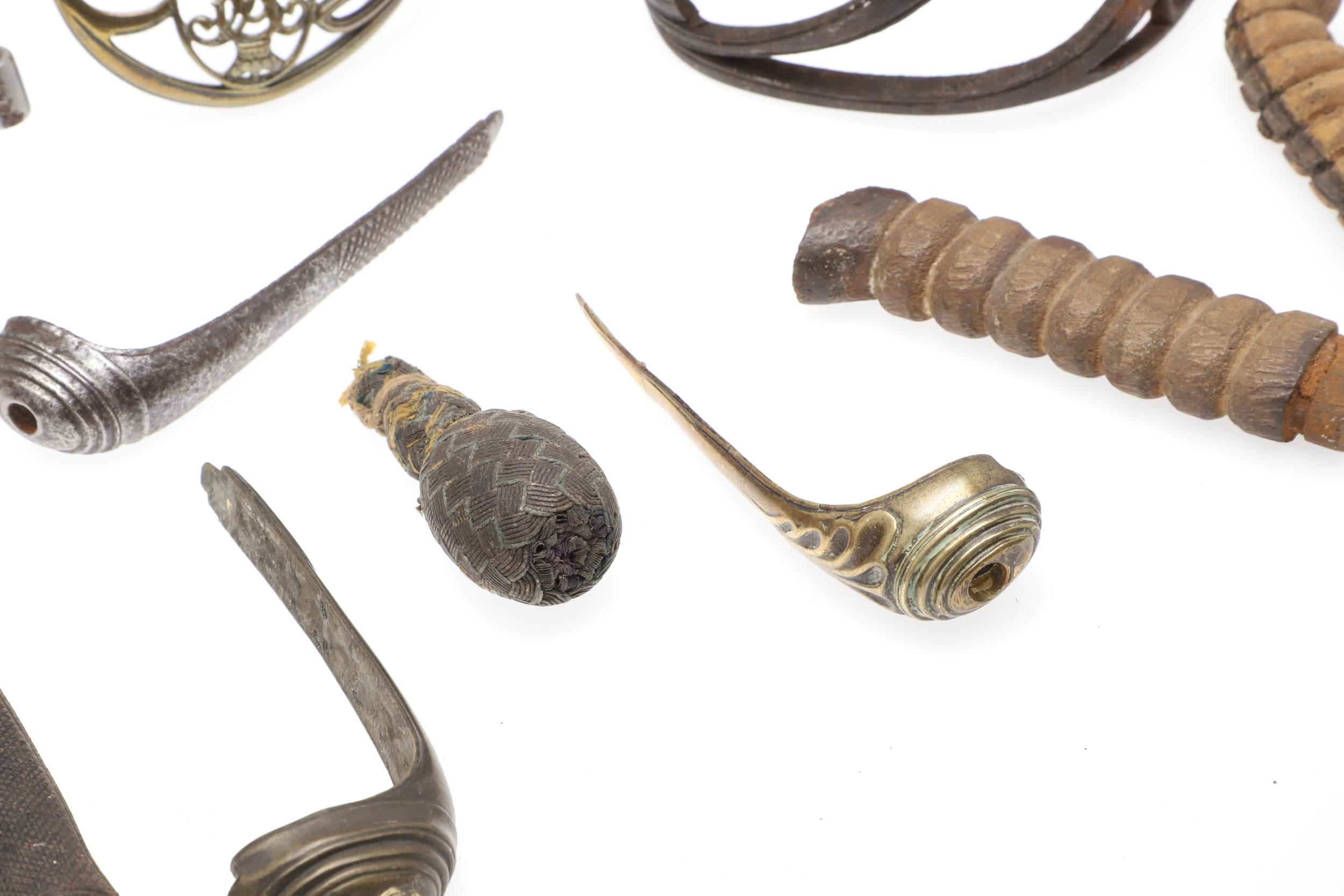 A COLLECTION OF SWORD FITTINGS TO INCLUDE GRIPS, GUARDS AND OTHERS. - Image 6 of 12