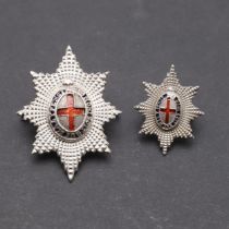 A COLDSTREAM GUARD'S OFFICERS SILVER AND ENAMEL CAP BADGE AND ANOTHER.