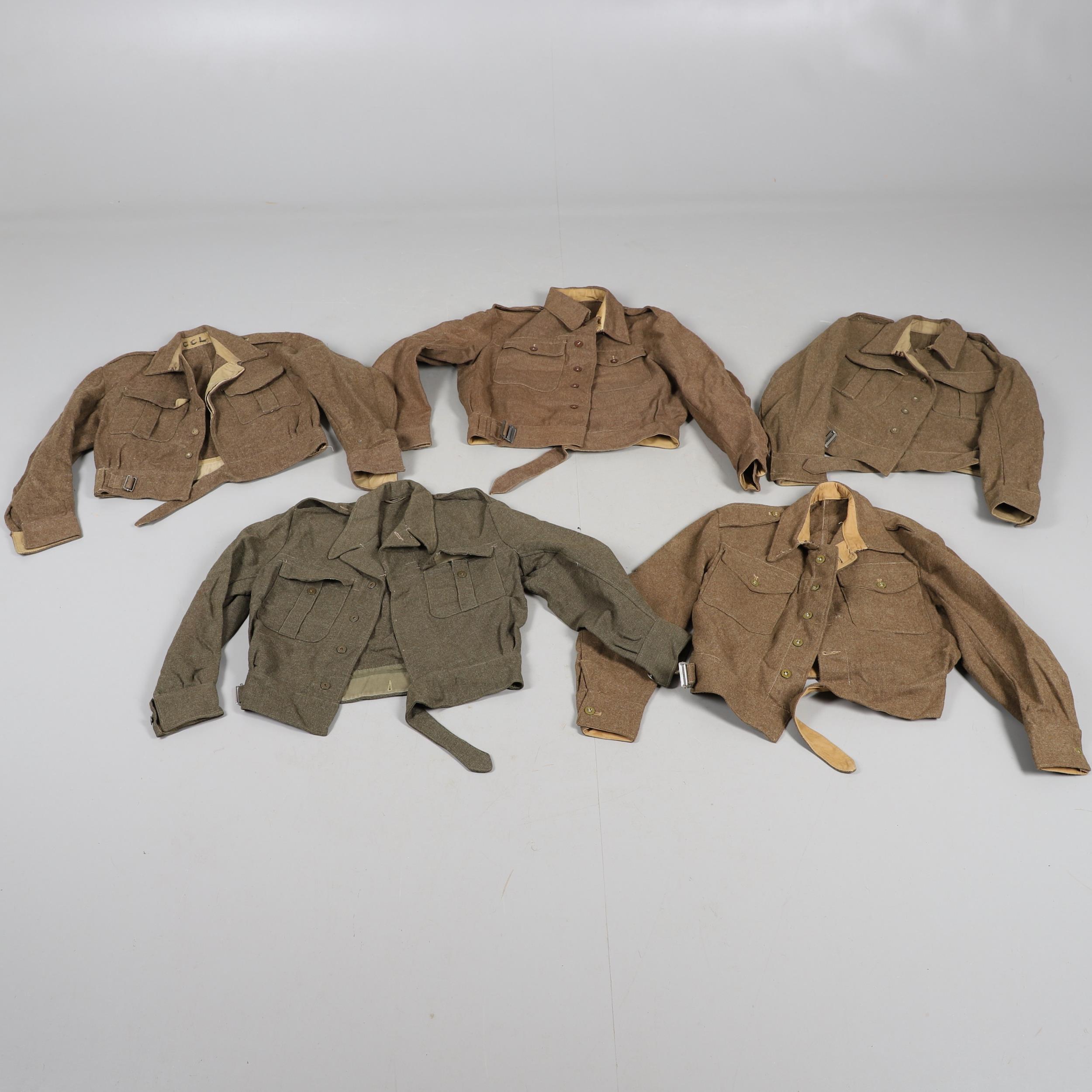 A COLLECTION OF FIVE SECOND WORLD WAR AND LATER BATTLEDRESS TUNICS. 1940 PATTERN AND SIMILAR.