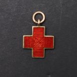AN UNUSUAL GOLD AND ENAMEL RED CROSS AWARD FOR 'WAR SERVICE'.