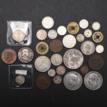 A COLLECTION OF WORLD COINS TO INCLUDE SILVER AND OTHERS.