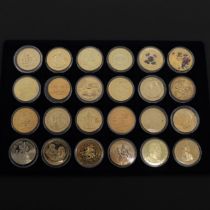 A COLLECTION OF GILT WORLD CROWN SIZED COINS.