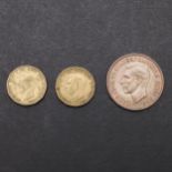 A GEORGE VI PENNY, 1951 AND TWO THREEPENCE 1946.