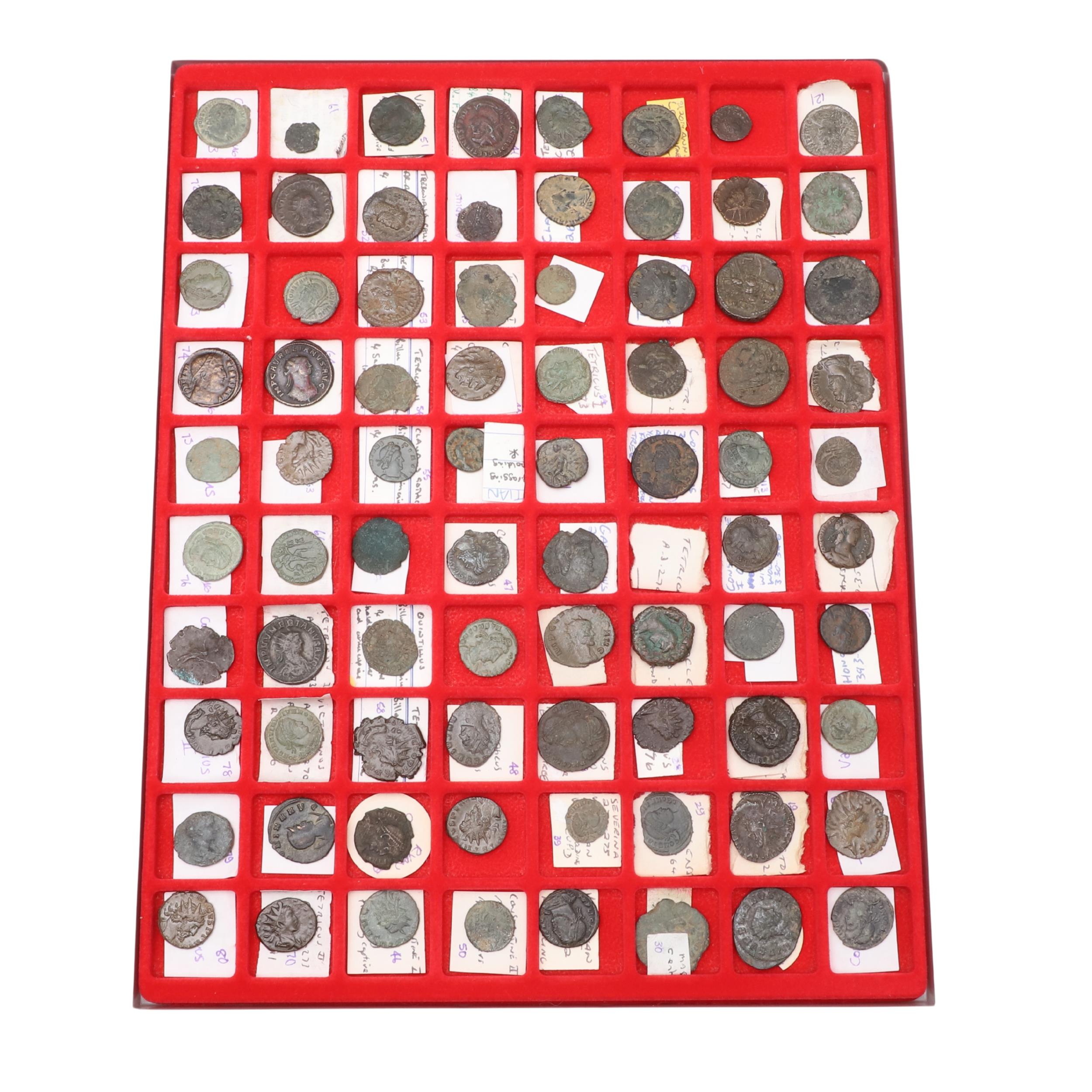 A COLLECTION OF ROMAN COINS IN A LINDNER COIN TRAY.