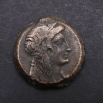 AN EGYPTIAN COIN, PROBABLY PTOLOMEIC.