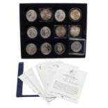 A COLLECTION OF TWELVE AMERICAN DOLLARS TO INCLUDE SILVER MORGAN DOLLARS.