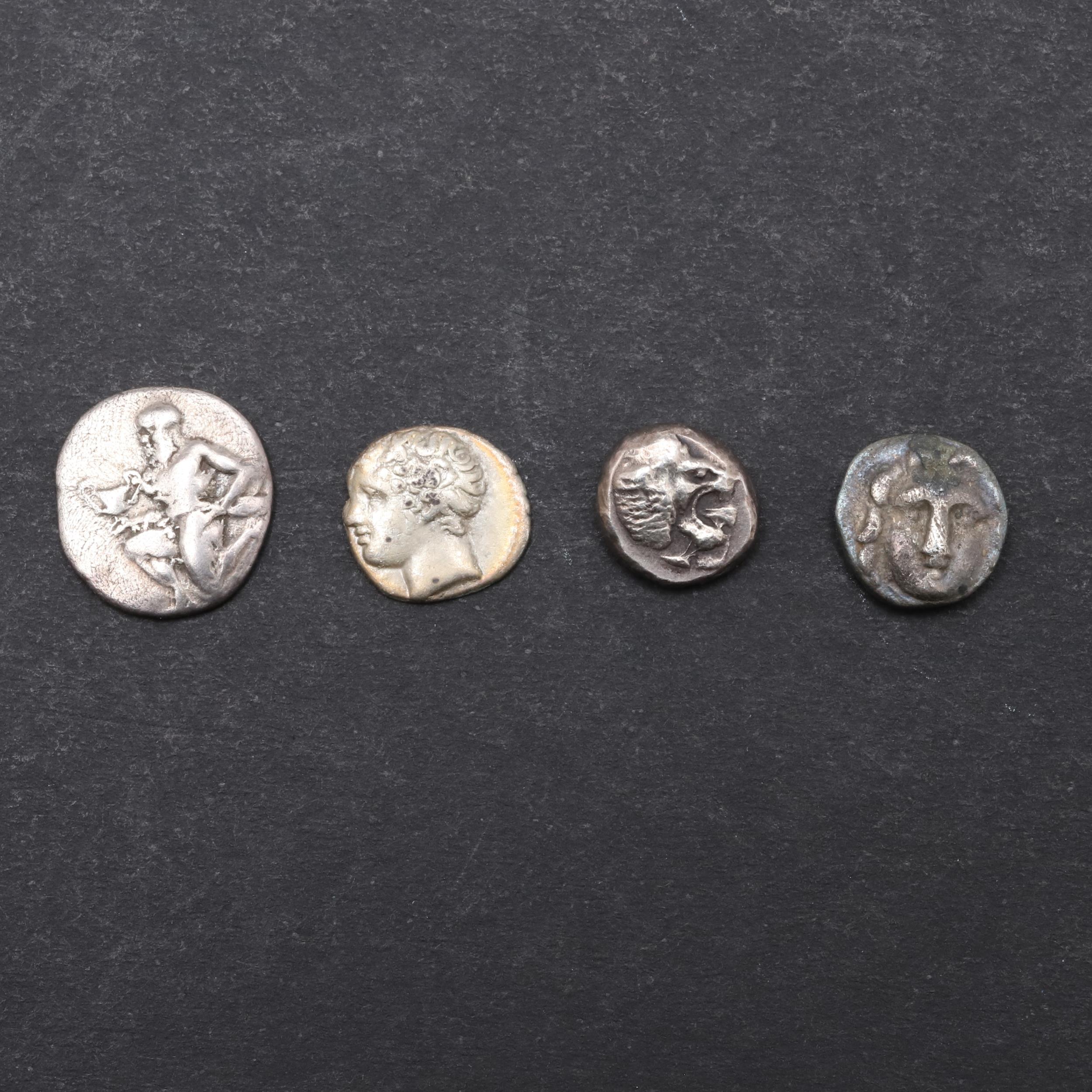GREEK COINS: FOUR SMALL DENOMINATION SILVER COINS TO INCLUDE THASOS.