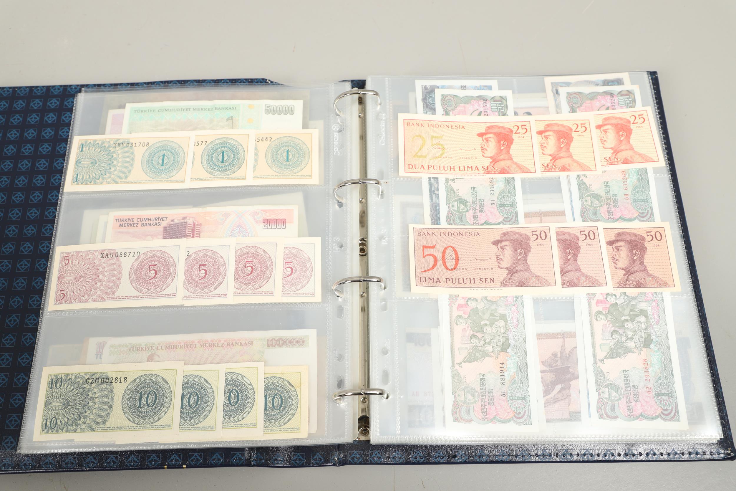 AN ALBUM OF OVER 150 WORLD BANK NOTES TO INCLUDE INDONESIA, IRAQ, CAMBODIA, ISRAEL AND OTHER COUNTRI - Bild 7 aus 15