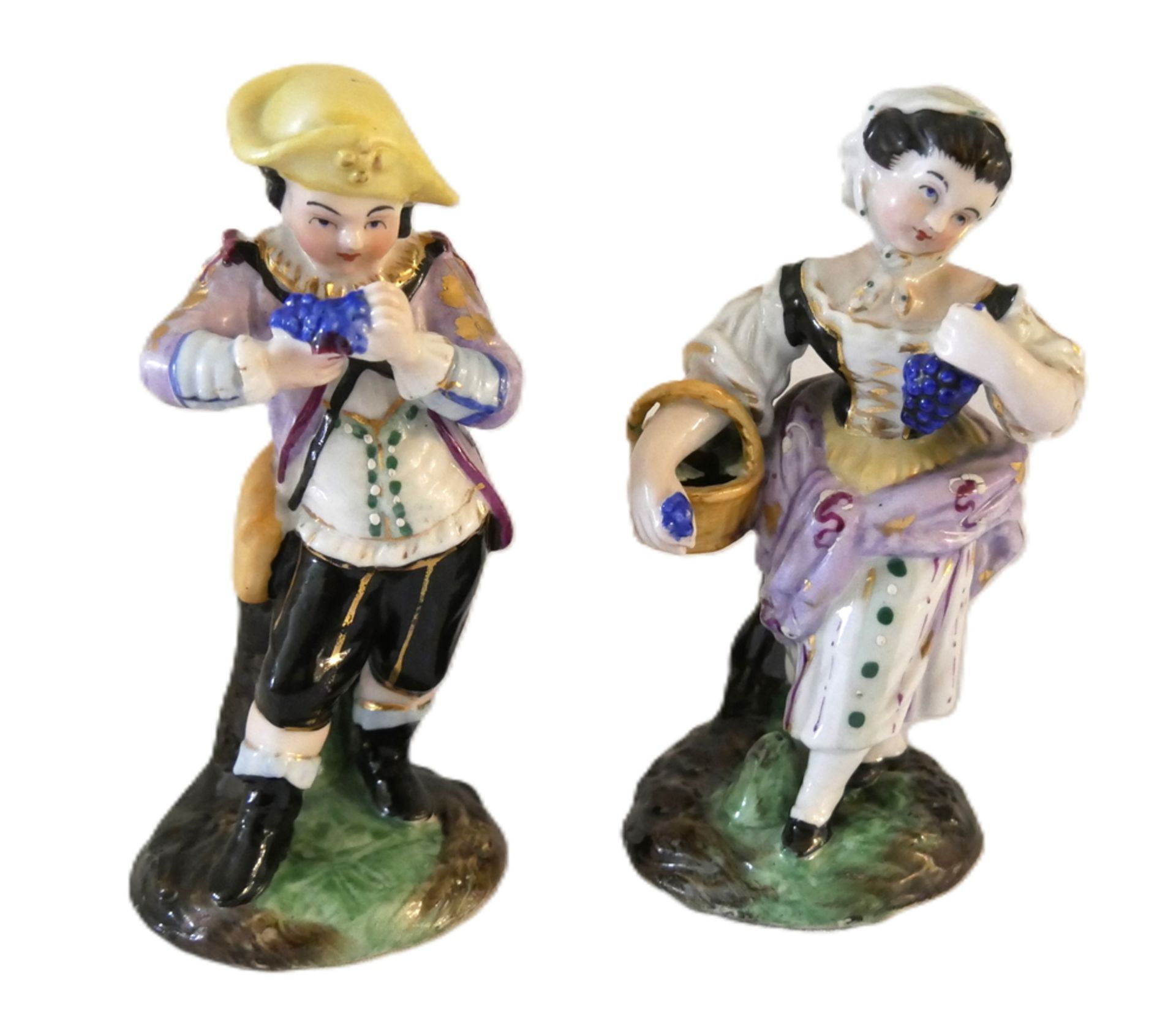 2 Porzellanfiguren, farbig bemalt. Am Boden mit Ritzmarke. Guter Zustand. Höhe bis ca. 12,5 cm um