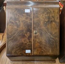 A 19th century walnut stationary box, the twin door opening to multiple storage compartments,
