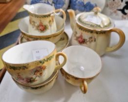A Victorian part tea set, the off-white ground with yellow top decorated with roses, the underside