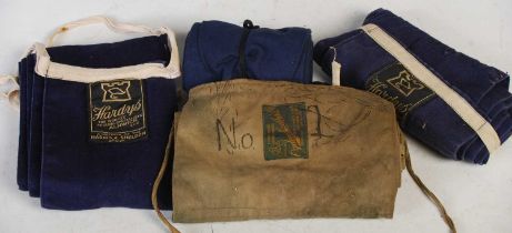 Fishing interest: three various Hardy's canvas rod sleeves, and one other.