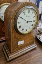 A Mappin oak and checker banded inlaid mantel clock with Roman numeral dial raised on four brass bun