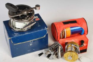 Fishing interest: three assorted fishing reels to include a boxed Penn 'Super Mariner No.49' reel; a