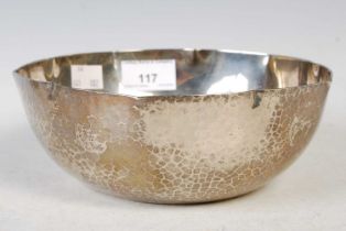 A Japanese white metal bowl with hammered finish, circa early 20th century, four-character mark to