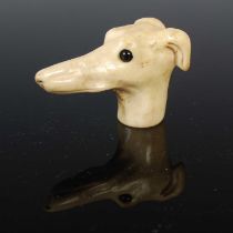 Dog interest: an antique carved bone walking cane finial carved in the form of a whippet's head,