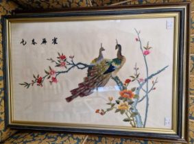 Two framed and glazed Chinese silkworks of exotic birds.