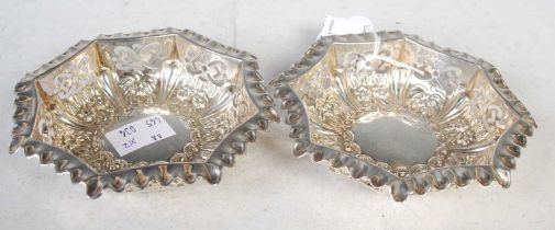 A pair of Birmingham silver octagonal shaped bon-bon dishes with pierced detail and embossed foliate