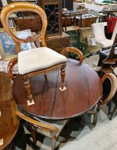 A late 19th century mahogany snap-top table, raised on a turned cylindrical column with three