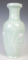 A Chinese porcelain celadon ground vase, early 20th century, with white slip decoration of blossom