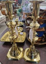 Three assorted brass chamber sticks, together with a pair of brass ejector candle sticks.