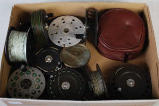 Fishing interest: a collection of assorted fishing reel spools.