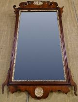 A pair of George III style mahogany and parcel gilt fret-cut wall mirrors, the tops with pierced