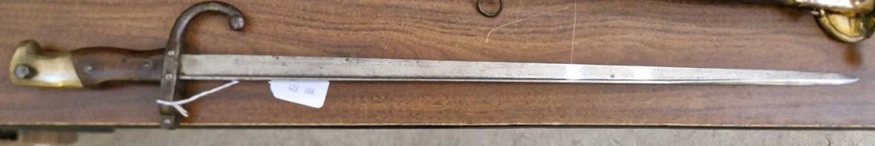 A late 19th century French M1874 Gras bayonet, the solid brass pommel with press stud and external