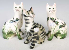 A group of Griselda Hill pottery to include a pair of seated cats decorated with dragonflies, and