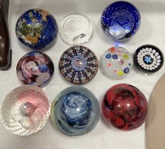 A collection of art glass paperweights to include a millefiori paperweight, various Caithness