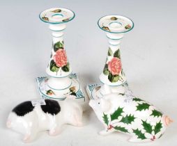 A group of Griselda Hill pottery to include a pair of candlesticks decorated with roses, a
