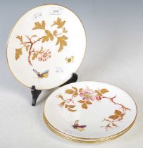 Three Victorian dessert plates, 23.5cm diameter, decorated in shallow relief with flowering branches