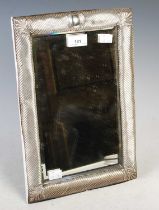 A Birmingham silver mounted dressing table mirror, enclosing a bevelled rectangular mirror plate,