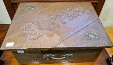 An Arts & Crafts copper embossed slipper box.