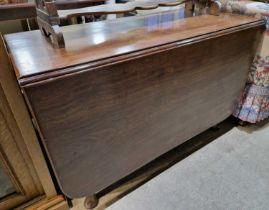 A 19th century mahogany drop-leaf gate leg table.