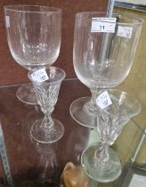 A pair of 19th century clear glass goblets, 16cm high, together with a pair of 19th century facet