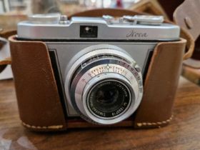 A vintage Lloca Rapid camera, with 45mm lens in a fitted leather case.