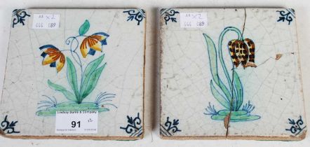 Two late 18th/ early 19th century Continental pottery tiles, one decorated with a tulip, the other