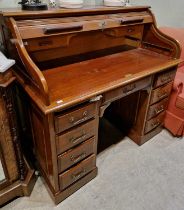 An antique mahogany rolltop desk.