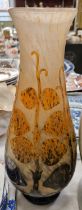 An early 20th century French cameo art glass vase, decorated with fruit vines in a mottled orange