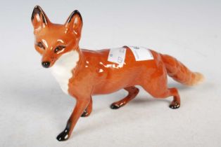 A Beswick model of a fox, 23.5cm wide.