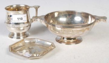 A group of silver to include a Birmingham hallmarked christening mug inscribed 'Jim' with horizontal