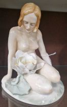 An ENS porcelain figure of a nude female and lily flower, printed marks, 16cm high.